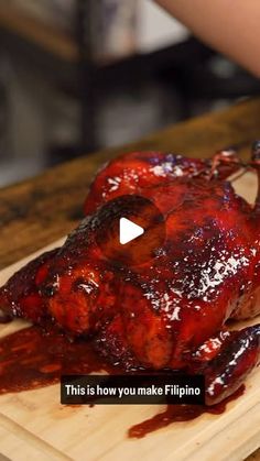 someone cutting up a piece of meat on top of a wooden board with the words, this is how you make filipinoo