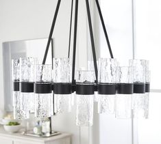 a chandelier with many glasses hanging from it