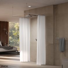 a bathroom with a large shower and white curtains