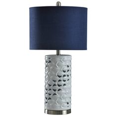 a white table lamp with a blue shade on the base and a silver metal frame