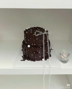 a chocolate cake sitting on top of a white counter