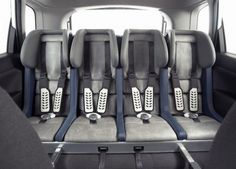 the rear seats of a car with black and gray trims are shown in this image