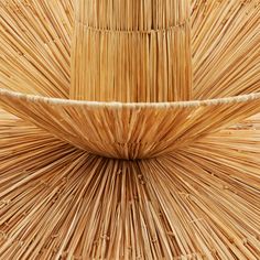 the back side of a bamboo chair made out of sticks