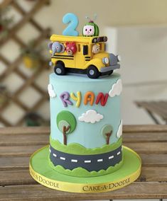 a birthday cake with a school bus on top