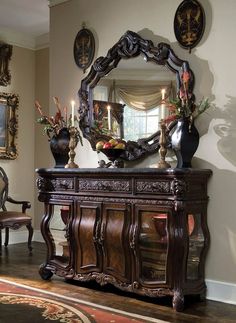 a large mirror sitting on top of a wooden dresser