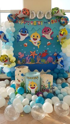 an ocean themed birthday party with balloons and decorations