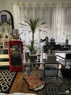 a living room filled with lots of furniture and plants