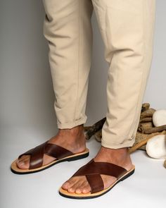 Greek leather sandals for men are a timeless and classic choice in footwear. They are handmade from high-quality leather and are both comfortable and durable. Their simple yet elegant design makes them a must-have for any fashion-conscious man's wardrobe, and they are suitable for any occasion, from a casual day out to a more formal event. All of our products are handmade with the best and highest quality leather from our beloved island of ''Crete''.  The leather used for each item may be irregu Brown Leather Footbed Toe Ring Sandals, Leather Sandals Men, Leather Sandals For Men, Mens Shoes Sandals, Sandals For Men, Mens Leather Sandals, Genuine Leather Sandals, Greek Sandals, Leather Slides