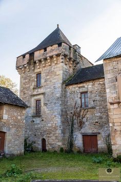 an old stone building with two towers