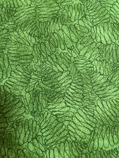 a close up view of a green fabric