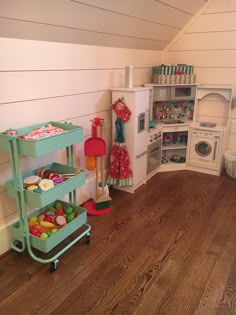 a play kitchen with lots of toys in it