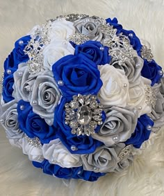 a bridal bouquet with blue and white flowers on a furnishing area,