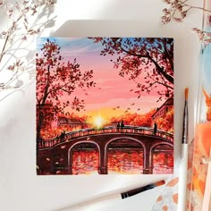 a painting of a bridge over a river at sunset