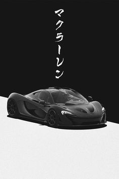 a black and white photo of a sports car with japanese writing on the back side