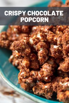 crispy chocolate popcorn in a blue bowl with text overlay that reads, crispy chocolate popcorn