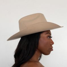 The Upland Western Cowboy Hat seamlessly blends the rustic charm of the Wild West with a dash of futuristic boho flair. With its distinctive cowboy silhouette, complete with a cattleman creased crown and a stylish upturned brim, this hat exudes classic Texan allure. The leather band is adorned with gleaming silver jewels, adding a contemporary twist to this timeless fashion statement. Handcrafted and meticulously embroidered with the initials "BTR," this hat exemplifies the perfect fusion of tra Solid Color Curved Brim Felt Hat For Rodeo, Western Curved Brim Hat For Rodeo, Classic Hat For Western-themed Events, Classic Hats For Western-themed Events, One Size Fits Most, Solid Color Flat Brim Felt Hat For Western-themed Events, Solid Flat Brim Felt Hat For Western-themed Events, Country Style Wide Brim Top Hat For Rodeo, Solid Felt Hat With Flat Brim For Western-themed Events, Fitted Western Hat For Western-themed Events