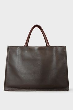 A large dark brown tote bag with a rectangular body. It has a wide top with a magnetic closure. The bag has 2 handles to be carried handheld or as a shoulder bag. Aesthetics Scenery, Work Tote Bag, Pocket Books, Stylish Office, Work Tote, Work Bag, Work Bags, Modern Women, Minimalist Aesthetic