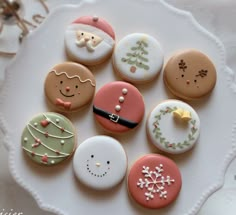 some decorated cookies on a white plate