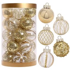 gold and white ornaments in a glass container