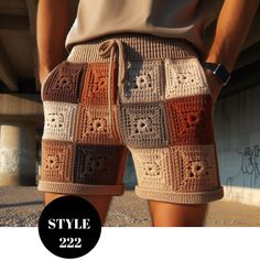 a man wearing shorts with crocheted squares on them