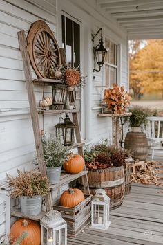 an outdoor porch with pumpkins and other decorations