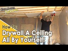 a man is working on the ceiling in his house with text overlay that reads how to drywall a ceiling all by yourself