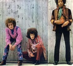 the rolling stones are posing for their album cover photos in front of a wooden wall