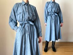 "This 80s vintage chambray dress by Norma Kamali is equal parts romantic & utilitarian chic. Dress features a shirtdress style silhouette with an oversized bodice, nipped in waist with front & back pleats, & beautiful voluminous midi length circle skirt. Wide set batwing style tapered sleeves with buttoned cuffs, flap button chest pockets, side pockets, buttoned placket closure. Dress comes with matching sash tie belt. Fabric is  a lovely textural cotton chambray in blue. Dress has a very faint Denim Midi Dress, 80s Dress, Shirt Dress Style, Chambray Dress, Norma Kamali, 80s Vintage, 1980s Vintage, Circle Skirt, Chic Dress