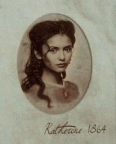 an old photo of a woman with long hair