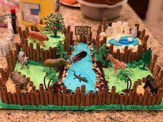 a cake that is shaped like a zoo