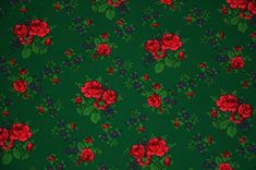 a green background with red roses on it