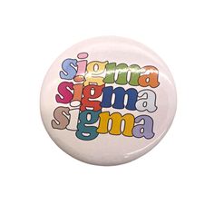 a white button with the words stigma stigmana in multicolored letters on it