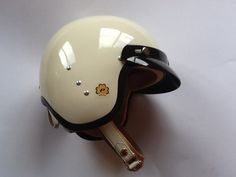 a white helmet is attached to a pair of keys