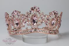 a pink tiara with crystal stones on it