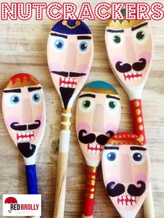 four wooden spoons with painted faces and mustaches on them, sitting next to the words nutcrackers