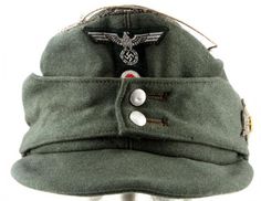 an army green hat with white buttons on it