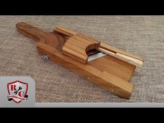 a wooden knife sharpener sitting on top of a table