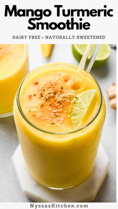 two glasses filled with mango turment smoothie and garnished with lime