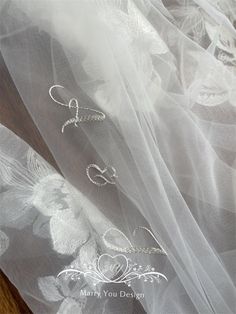 the veil is white and has three different designs on it