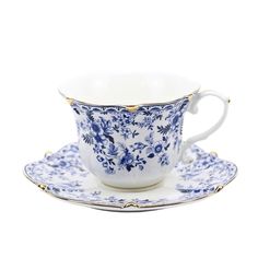 a blue and white tea cup on a saucer