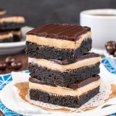 three chocolate desserts stacked on top of each other