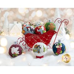 an assortment of christmas ornaments in a sleigh