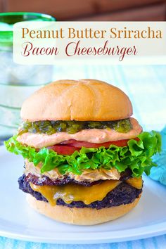 a bacon cheeseburger with lettuce and tomato