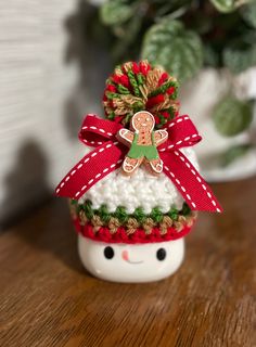 a small christmas ornament with a gingerbread man on it