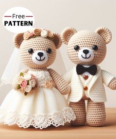 two crocheted teddy bears dressed up in wedding attire, one holding the other's hand