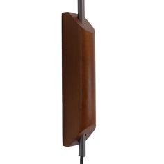 a wooden wall mounted hook on the side of a white wall with a metal pole