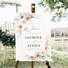 an easel with a sign that says welcome to the couple and their wedding date