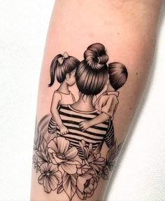 two girls hugging each other with flowers on their arms and behind them is a black and white tattoo