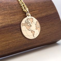 14K solid gold World Map Necklace, Earth jewelry, Gold Coin Globe gift, Earth charm, personalized gift, Traveler gift, Nautical Necklace Popular with all age groups. An ideal gift for anyone you love and it will be treasured forever. ⚜️ Pendant Material: 14K Solid Real Gold (NOT GOLD PLATED)  ⚜️ Hallmark for certification engraved on the back: 585 and my registered stamp  ⚜️ Design - We design everything in house.  ⚜️ Manufacturing - We make each piece we design in our workshop. The pendant is p Yellow Gold Pendant Necklace As Souvenir, Engraved Round Pendant Jewelry As Souvenir, Engraved Round Pendant Jewelry For Souvenir, Yellow Gold Pendant Jewelry Souvenir, Yellow Gold Pendant Jewelry As Souvenir, Yellow Gold Pendant Jewelry For Souvenir, Gold Pendant Necklace As Souvenir, Gold Engraved Jewelry Souvenir, Engraved Gold Jewelry As Souvenir