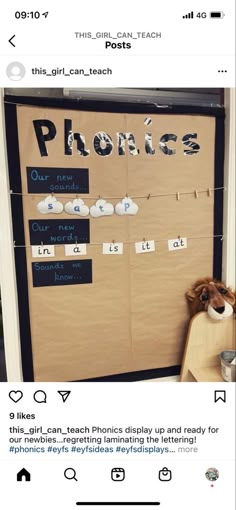 a bulletin board with writing on it and a teddy bear sitting in front of it